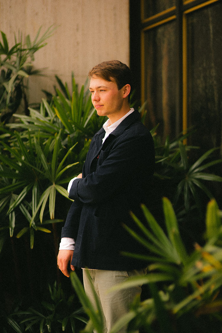 Man stands in front of the Timken Museum of Art at Balboa Park.
